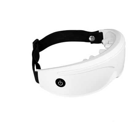 White and black eye massager with a goggle-like design, featuring a white frame and dark lenses, on a wooden surface. - Image 11