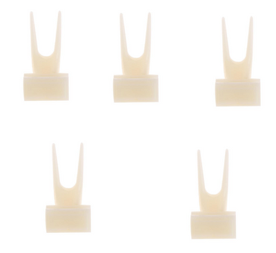 White plastic bird fruit fork clipped onto blue birdcage bars, designed to hold fruit or vegetables for pet birds. - Image 10