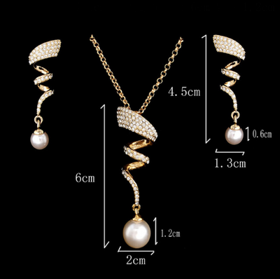 Gold-toned heart-shaped necklace and dangle earrings set with clear rhinestones and faux pearls. - Image 9