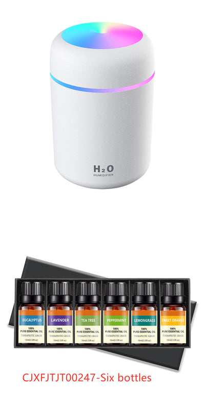 Pink ultrasonic aromatherapy essential oil diffuser with a colorful LED light band and top light, labeled H2O Humidifier. - Image 11