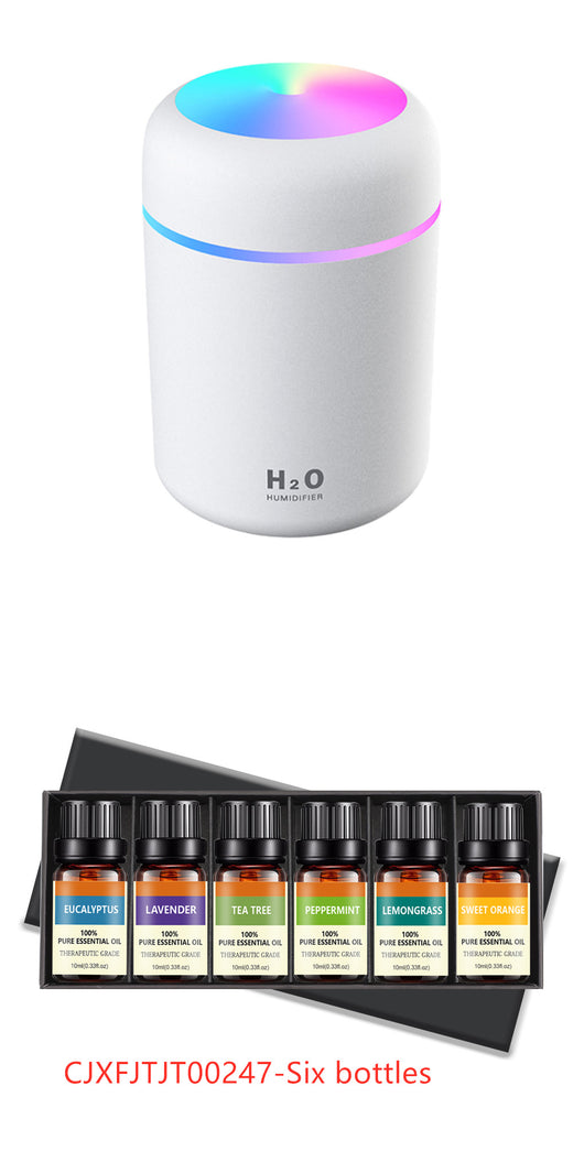 Pink ultrasonic aromatherapy essential oil diffuser with a colorful LED light band and top light, labeled H2O Humidifier. - Image 11
