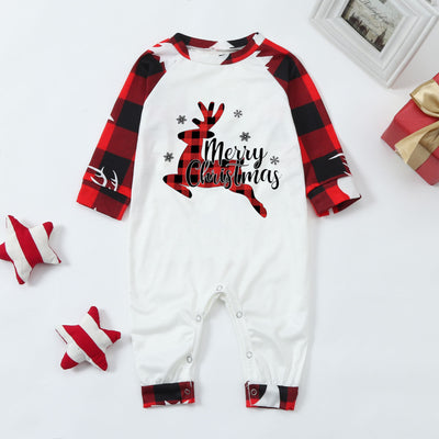 Family matching Christmas pajamas with red and black buffalo plaid, white reindeer, and Christmas tree prints. - Image 11