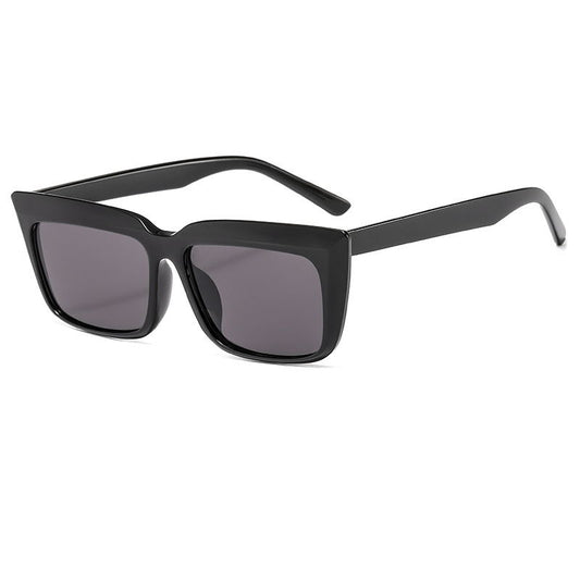Light blue rectangular sunglasses with dark lenses and thick frames, angled to show the temples and front.