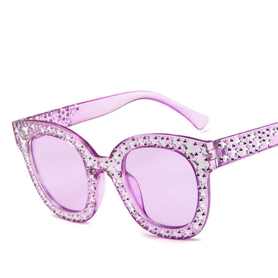 Black cat-eye sunglasses for ladies, featuring silver star embellishments on the frames and temples. - Image 12