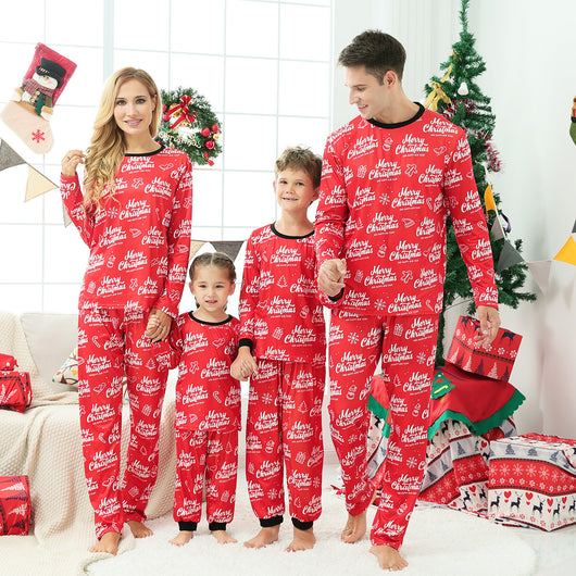 Family of four wearing matching green Christmas pajamas with snowman and Christmas tree print, red trim. - Image 5