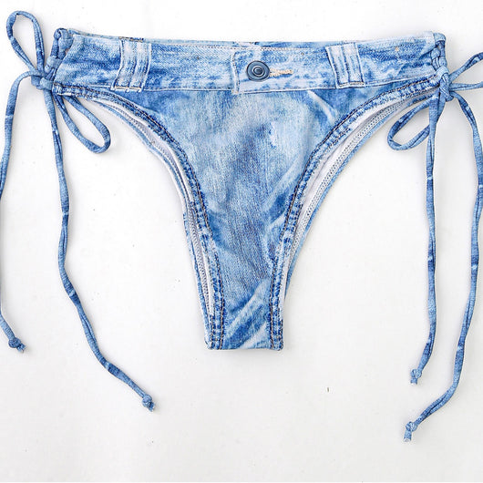 Women's light blue denim print two-piece bikini swimsuit with a halter neck top and tie-side bottoms, styled with a straw hat and sunglasses. - Image 11