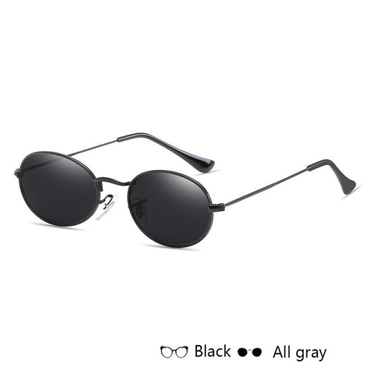 Gold-framed oval sunglasses with black mirror lenses and black temple tips, shown at an angle. - Image 3