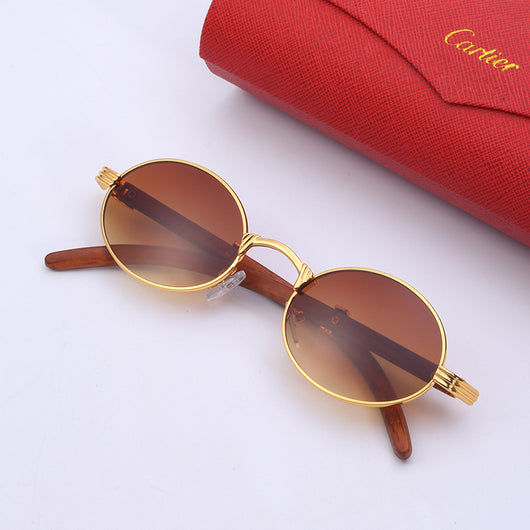 Retro oval sunglasses with gold metal frames and dark wood-like temples, featuring gradient black lenses. - Image 16
