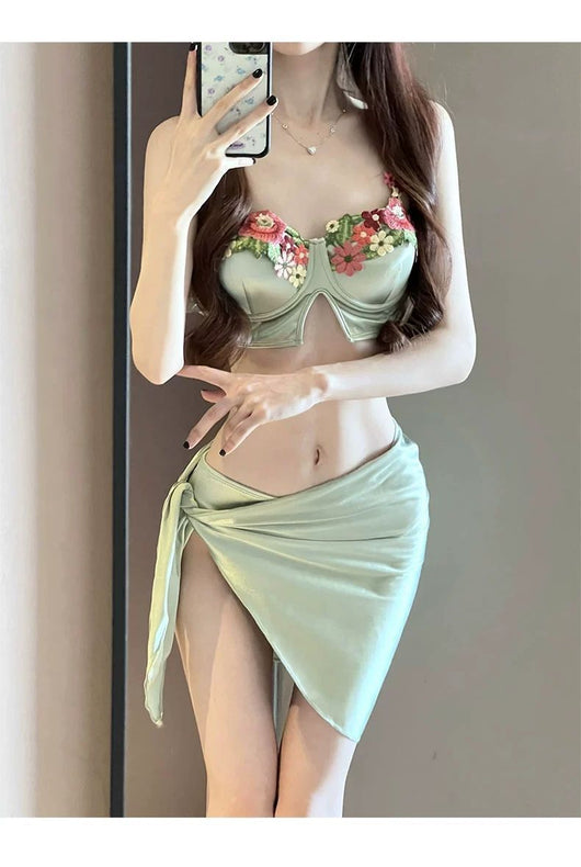 Women's light green three-piece bikini with floral embroidered triangle top, matching bottoms, and a sarong skirt. - Image 9