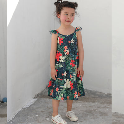 Child's white short-sleeve t-shirt with a horizontal tropical leaf and orange flower print band across the chest. - Image 2
