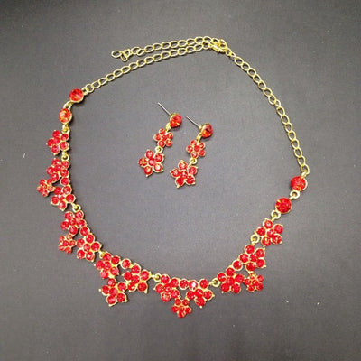 Sparkling crystal bridal jewelry set with floral necklace, drop earrings, and a matching tiara on a bride. - Image 7