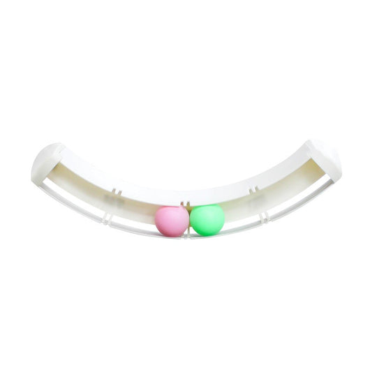 White curved track cat toy with green and pink balls, mounted on a blue wall, with two cats playing. - Image 4