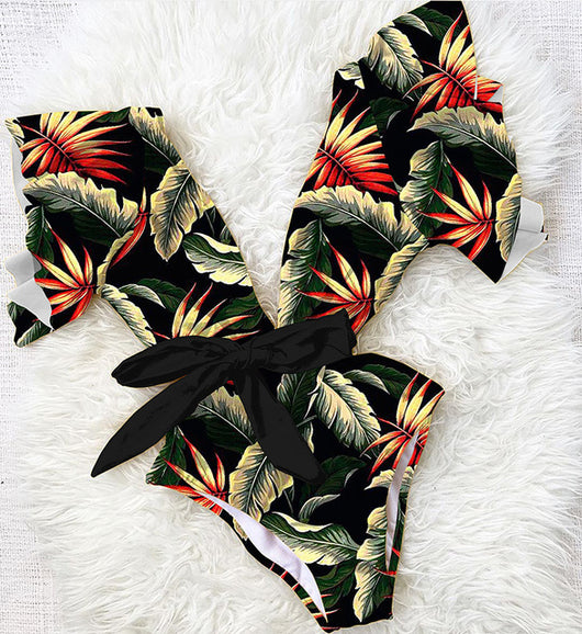 Coral one-piece swimsuit with deep V-neck, ruffled sleeves, and tie-front waist, featuring pink and teal floral print. - Image 16