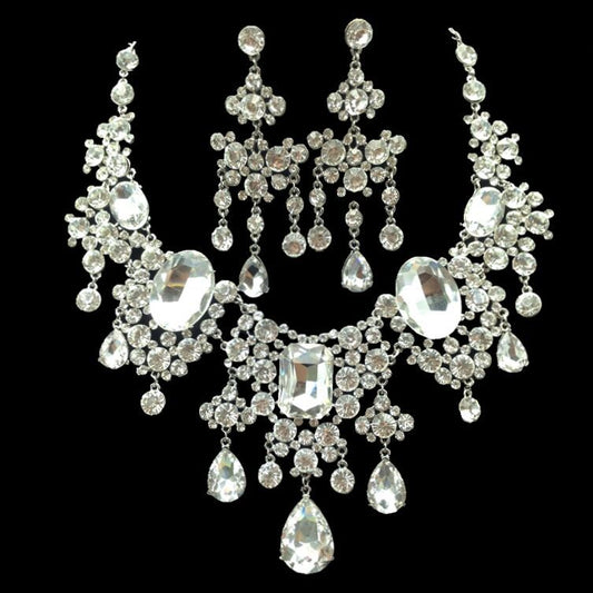 Sparkling rhinestone and crystal bridal jewelry set with a statement necklace and matching chandelier earrings.