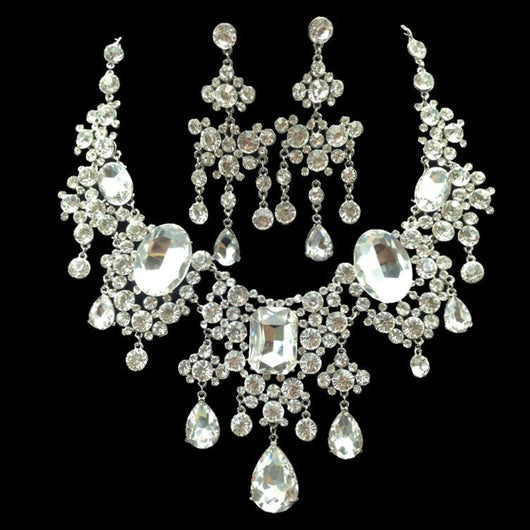 Sparkling rhinestone and crystal bridal jewelry set with a statement necklace and matching chandelier earrings.