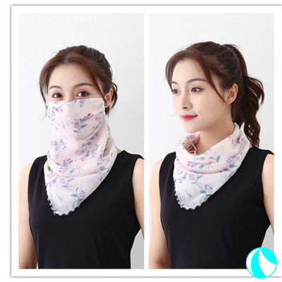 White women's UV protection scarf with black speckle pattern, worn as a face mask and neck scarf. - Image 10