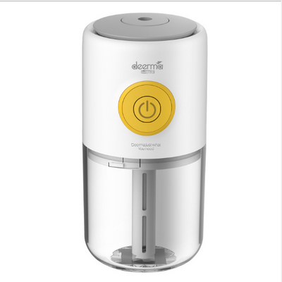 White and clear mini USB ultrasonic mist aroma essential oil diffuser with a yellow power button and gray top.