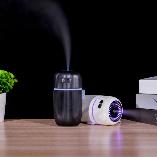 Black ribbed white noise humidifier with control buttons on top, designed to aid sleep and humidify. - Image 4