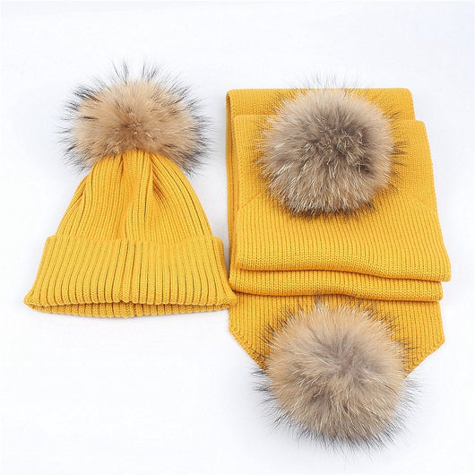 Red knitted hat and scarf set with fluffy brown and black fur pom-poms, ideal for warm winter wear. - Image 16
