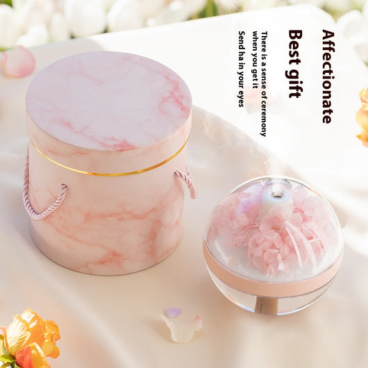 Pink round mini humidifier with clear dome, decorative pink flowers, and a light-up base, ideal for desktop or bedroom. - Image 2