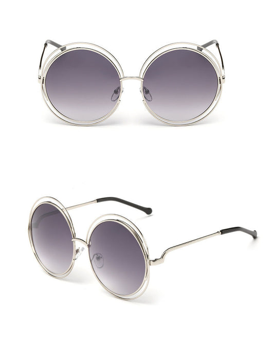 Round metal cutout sunglasses with silver mirrored lenses and a double-rimmed frame, shown from front and angled views.