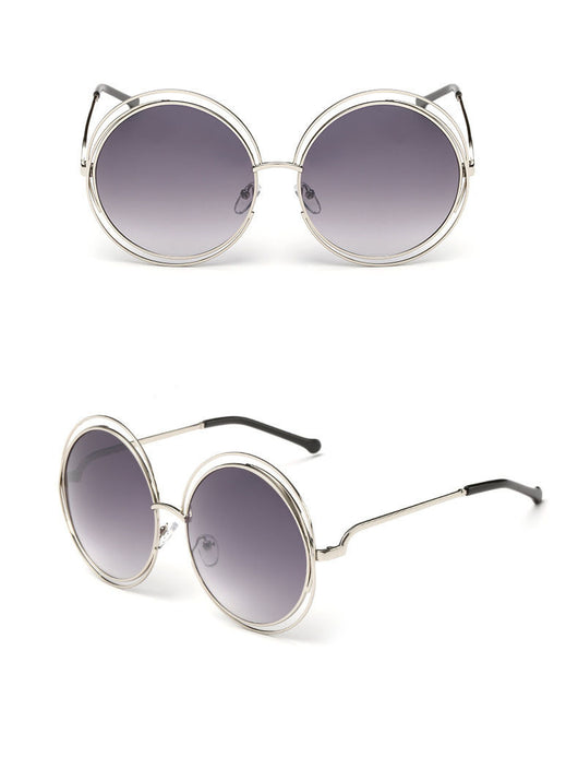 Round metal cutout sunglasses with silver mirrored lenses and a double-rimmed frame, shown from front and angled views.