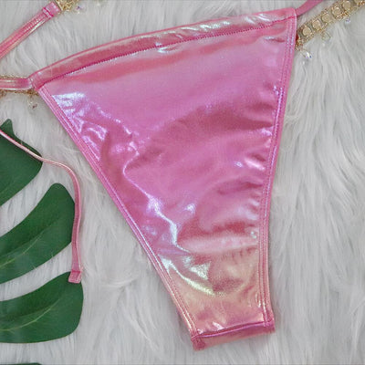 Iridescent purple and pink two-piece bikini with gold-toned crystal embellishments on a white faux fur background. - Image 23