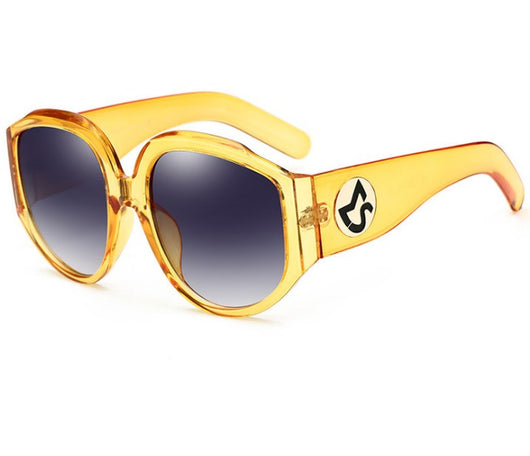 Oversize round sunglasses for women with olive frames, dark gradient lenses, and a gold emblem on the temples. - Image 13