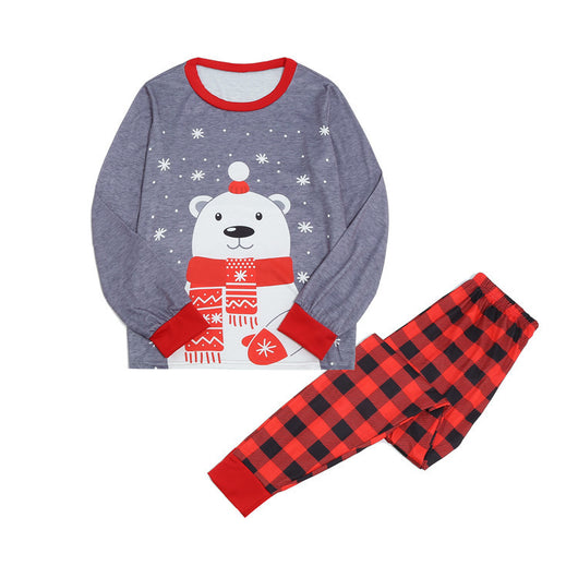 Family of five wearing matching gray and red buffalo plaid Christmas pajamas with polar bear print. - Image 6