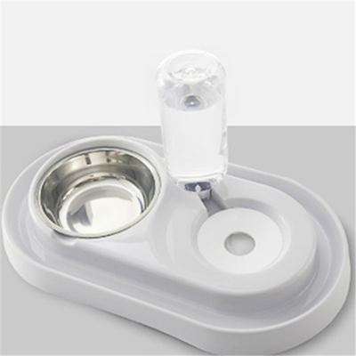 White pet feeding station with a stainless steel food bowl and a clear automatic water dispenser bottle. - Image 8