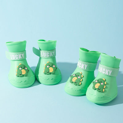 Four yellow silicone dog booties with a cartoon dog face emblem and "LUCKY" strap on a light blue background. - Image 6