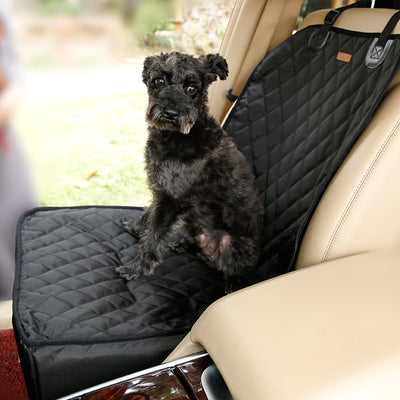 Black quilted waterproof pet car seat for front passenger seat, with a small black dog sitting inside. - Image 6