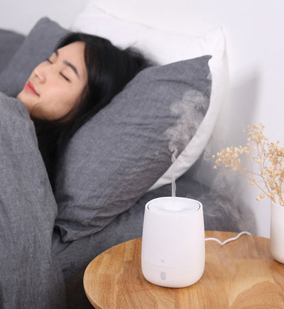 White mini aromatherapy machine with a minimalist design, featuring a top mist outlet and a single control button. - Image 7