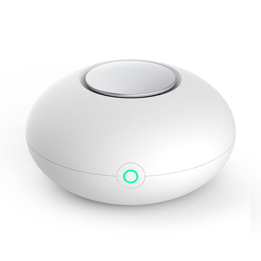White mini ozone generator and air purifier with a round, compact design and a green indicator light. - Image 10