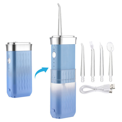 Portable water flosser in gradient pink and blue with four nozzles, a charging cable, and its product box. - Image 9