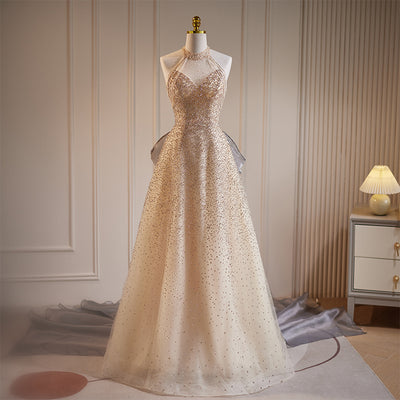 Vestido de Noche Champagne con Detalles de Flecos