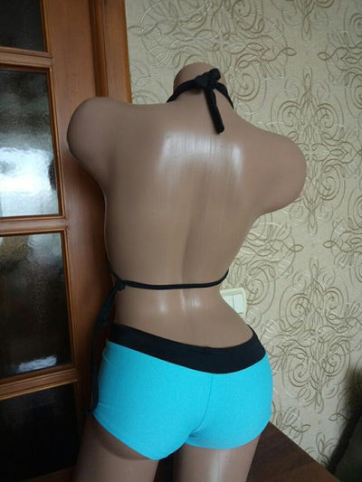 Black halter bikini suit with boy short bottoms, featuring pink and blue floral and flamingo patterns. - Image 15