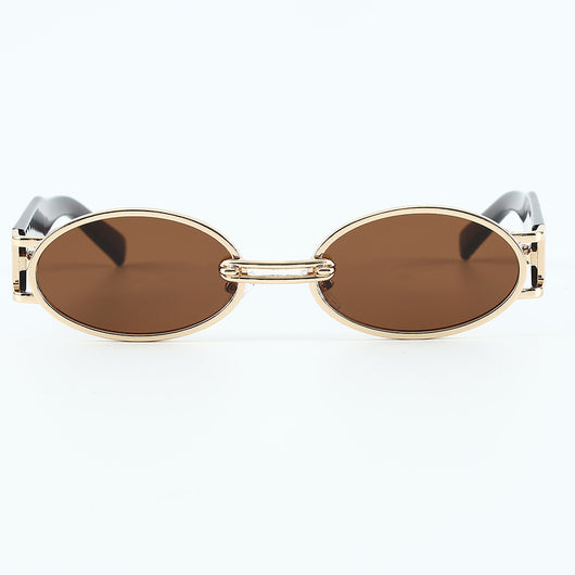 Retro small frame sunglasses with gold round frames and leopard print temples, held by a hand. - Image 21