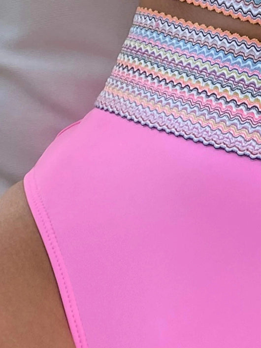 Hot pink split triangle high-waisted bikini with a colorful striped band, worn by a woman in a straw hat. - Image 32