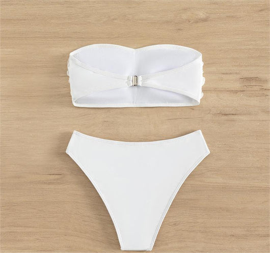 White tube top bikini swimsuit with 3D floral appliques and high-waisted bottom, modeled on a person. - Image 10