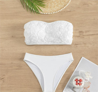 White tube top bikini swimsuit with 3D floral appliques and high-waisted bottom, modeled on a person. - Image 11