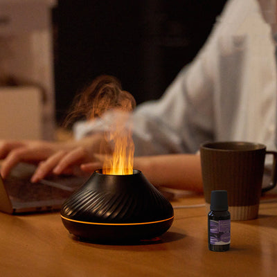 Black flame aromatherapy diffuser with purple mist and four essential oil bottles: Lily, Rose, Sakura, and Lemon. - Image 11