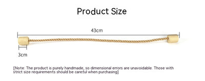 Black cylindrical magnetic curtain tieback holding a light blue pleated curtain, against a clean white background. - Image 16