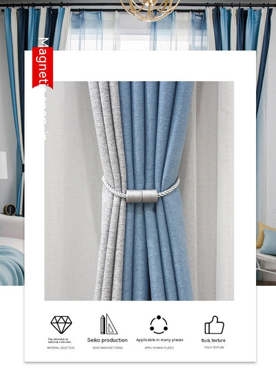 Black cylindrical magnetic curtain tieback holding a light blue pleated curtain, against a clean white background. - Image 19