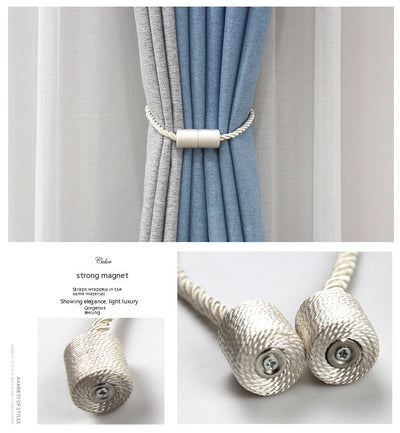 Black cylindrical magnetic curtain tieback holding a light blue pleated curtain, against a clean white background. - Image 20