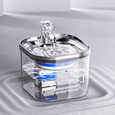 Automatic pet water fountain with clear reservoir, stainless steel top, and flowing water spout, shown with power adapter and filter set. - Image 18