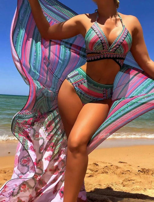 Women's three-piece bikini set with a colorful striped and geometric pattern, featuring a halter top, high-waisted bottoms, and a matching sheer cover-up, on a - Image 32