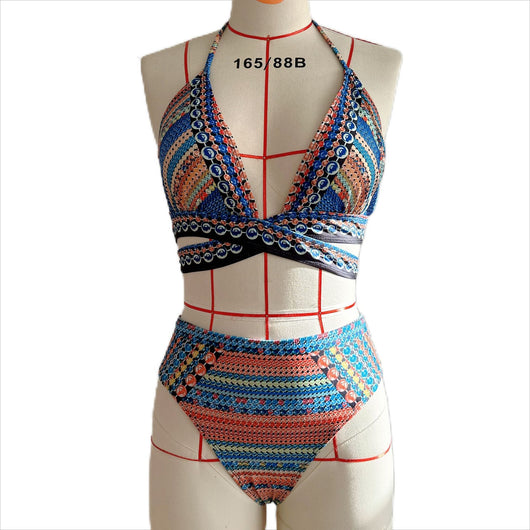 Women's three-piece bikini set with a colorful striped and geometric pattern, featuring a halter top, high-waisted bottoms, and a matching sheer cover-up, on a - Image 36