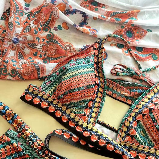 Women's three-piece bikini set with a colorful striped and geometric pattern, featuring a halter top, high-waisted bottoms, and a matching sheer cover-up, on a - Image 54