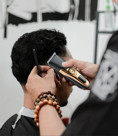 Gold and black three-in-one electric shaver with foil head, hair clipper, nose trimmer, and accessories. - Image 13